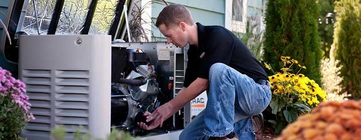 Generac-generator-service Licensed electrician in Franklin Park performing schedule maintenance on a Briggs & Stratton generator to maintain peak performance and avoid future issues